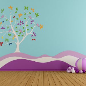 empty-playroom-girl-with-colorful-tree-wall